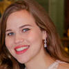 Headshot of smiling person with long hair.